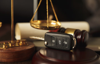 close up of judge gavel and car keys