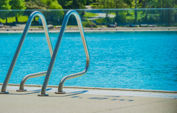 railing stairs down to the pool
